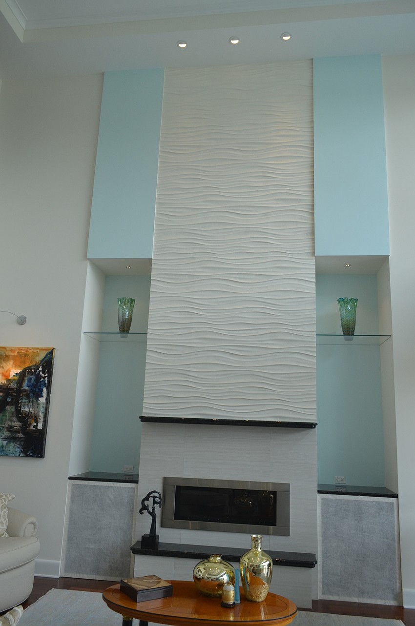The tile used on the fireplace is meant to resemble waves.