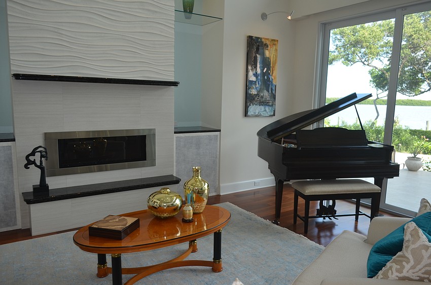 The living area features a 1927 George Steck piano.