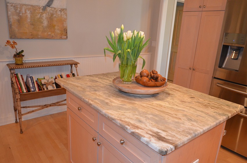 The kitchen countertops are made with Bavarian Brown granite.