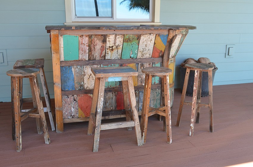 The backyard’s bar is made from fishing boats that washed ashore in Indonesia after the 2004 Indiana Ocean tsunami.