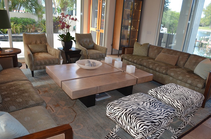 The zebra-striped bench in the living room is a favorite of Murphy’s dog, Flossy.
