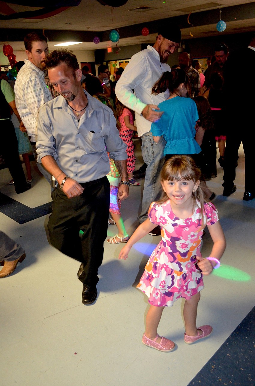 Daniel Poynter and his daughter, Peyton, spend most of the night on the dance floor.