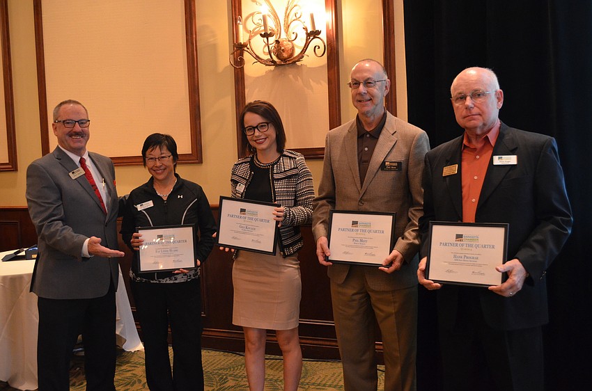 Greater Sarasota Chamber of Commerce President and CEO Steve Queior with ambassadors of the quarter Fay Lynne Huang, Gigi Kovach, Phil Mott and Hank Prograr.