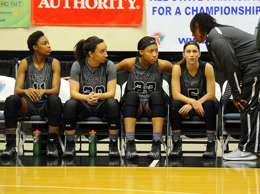 Lakewood coach Tina Hadley talks with India Searls, Elise Spiller, LaDazhia Williams and Kailyn Scully before the start of the game.