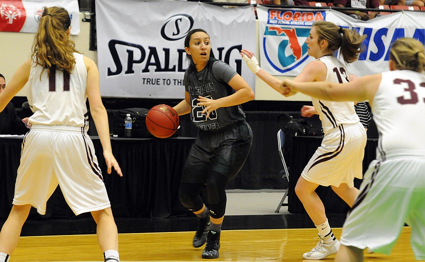 Lakewood Ranch senior guard Elise Spiller looks to pass the ball in the first quarter.