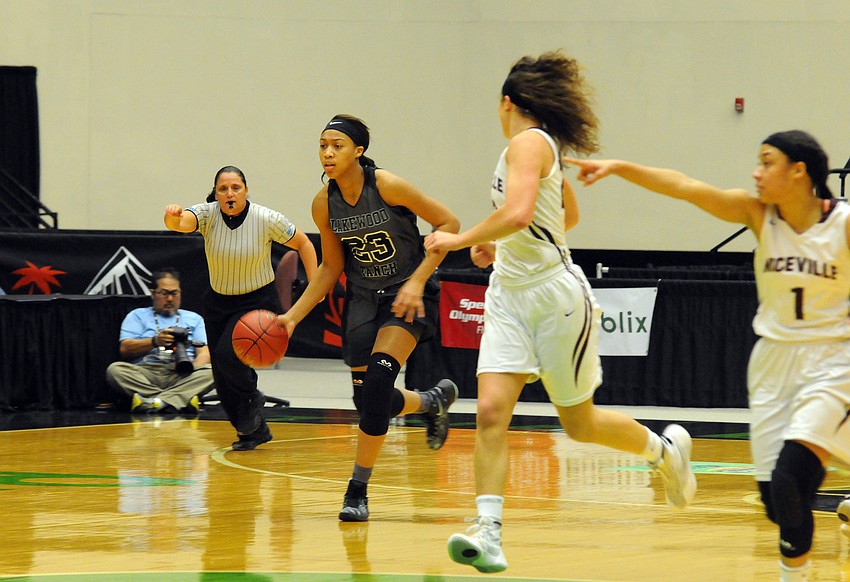 Lakewood Ranch junior forward LaDazhia Williams brings the ball up the court for the Mustangs.