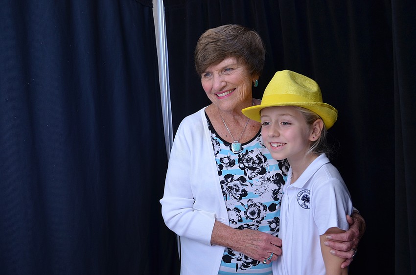 Connie Humphries poses with her granddaughter Celia in a photo booth.