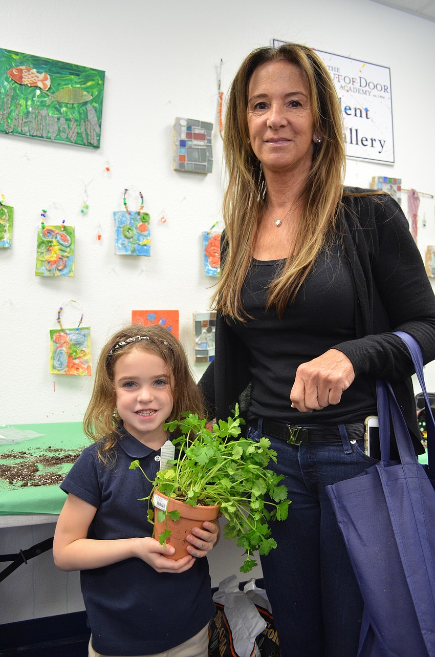 Jocelyn and her grandmother Celeste Williams with their freshly planted cilantro.