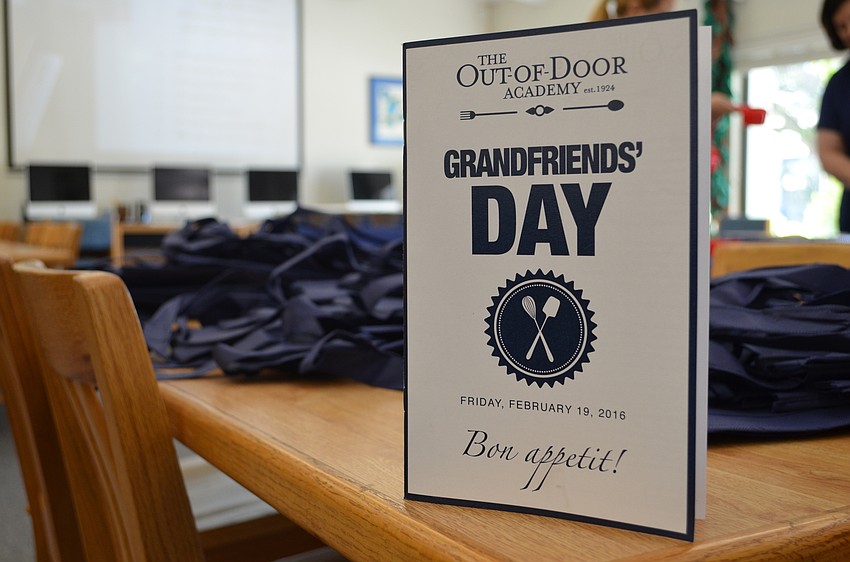 Grandparents were given a cook book with a collection of recipes from Out-of-Door Academy families.