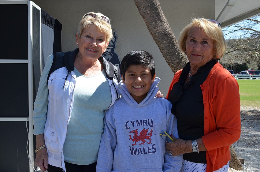 Proud grandmothers Sue Hanes and Cooky Connolly with their grandson Arlo.