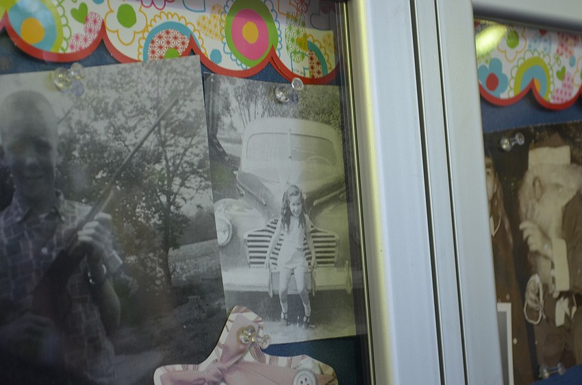 Victoria Frigo at age six stands in front of her father's Buick. Grandparents were asked to bring in a photo of themselves when they were younger for their grandchildren to see.