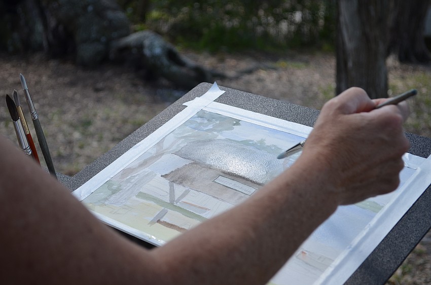 Nancy Clayburn paints her work using watercolors.