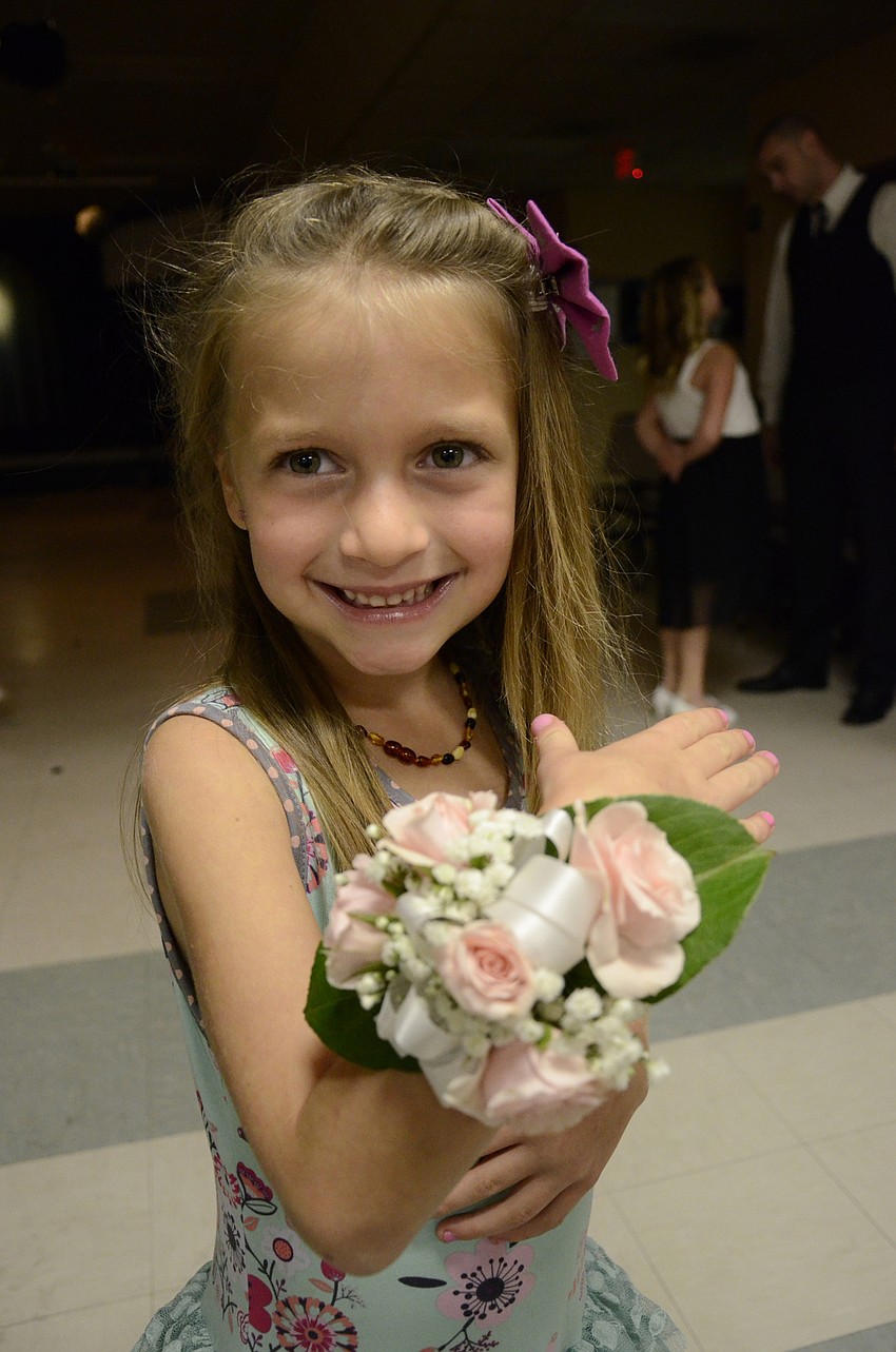 Taryn Factor shows off her corsage.