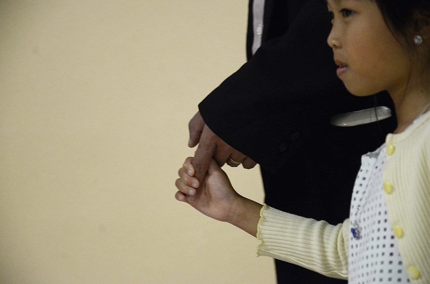 Sophia and Dan Tong wait for a photo.