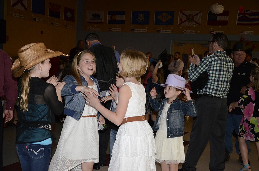 Ella Brauch, Kaylie Holland, Maggie Todd and Kennedy Boggs get excited for a song.