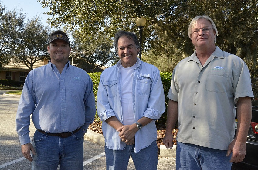 Shaun Bless, left, and John Maenelli, right, of Aquagenics, and Ernesto Lasso De La Vega, center, of the Lee County Hyacinth Control District, lead the nature walk.