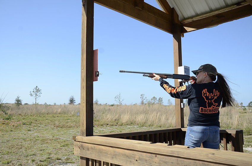Heidi Moore strikes a clay pigeon during her round.