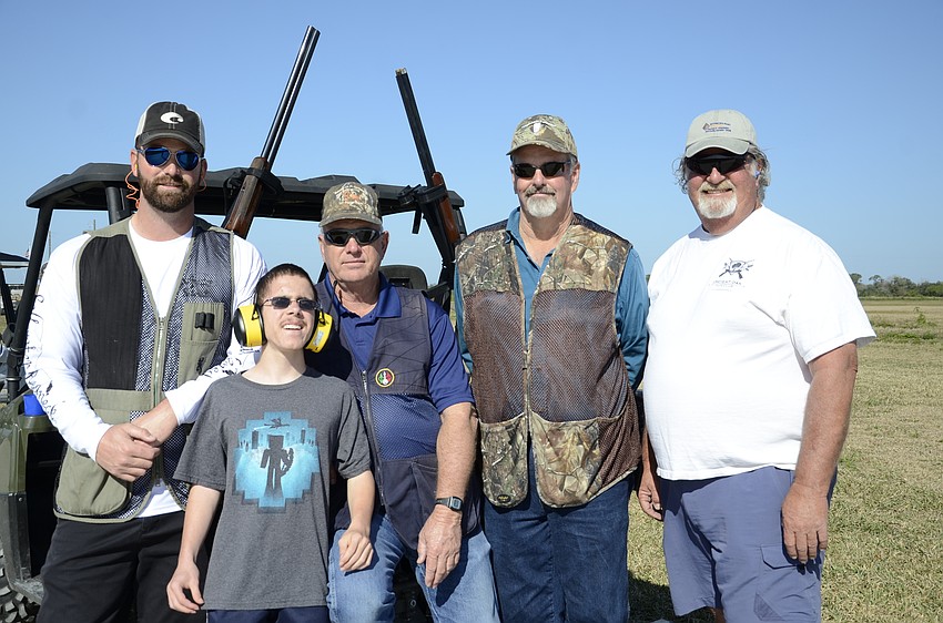 Chance, Tyler and Powell Helm and Larry Cline and John Barnott shoot for Kiwanis member Danny Cacchiotti.