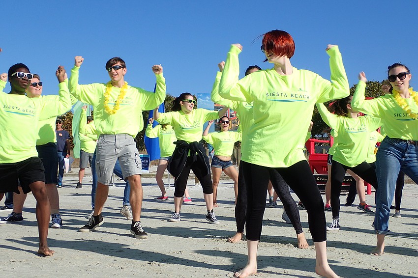 A flash mob of students from Booker High School's visual and performing arts program celebrates