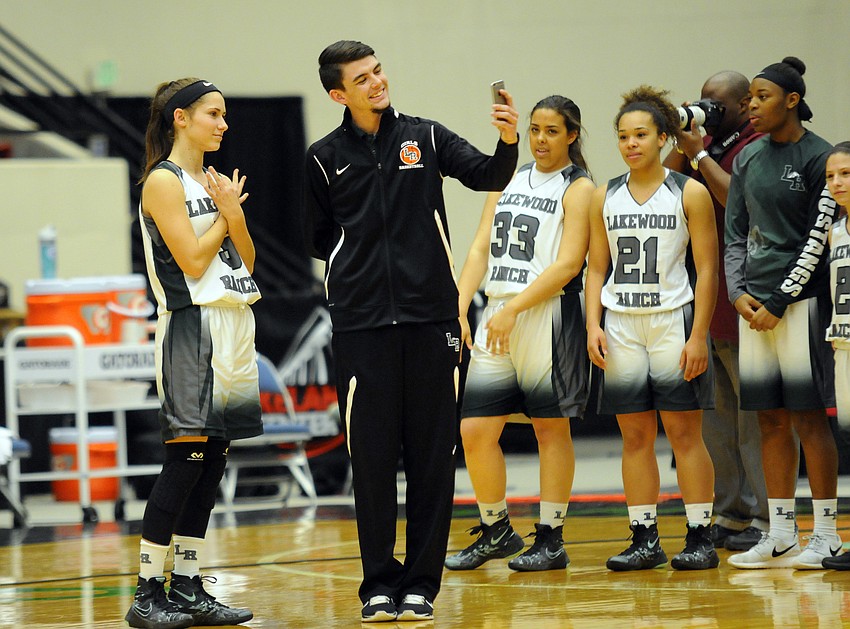 Lakewood Ranch senior point guard Kailyn Scully does one last handshake with coach Karter Clark.