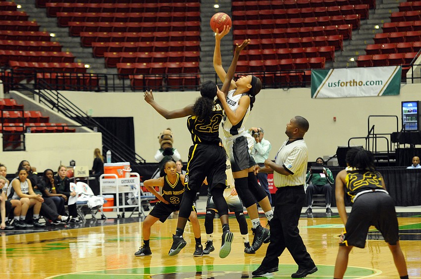 Lakewood Ranch junior forward LaDazhia Williams wins the tipoff for the Mustangs.