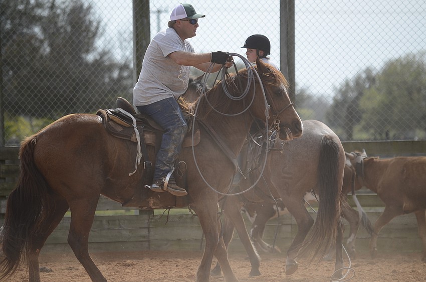Mike Woodham tries to get a steer.