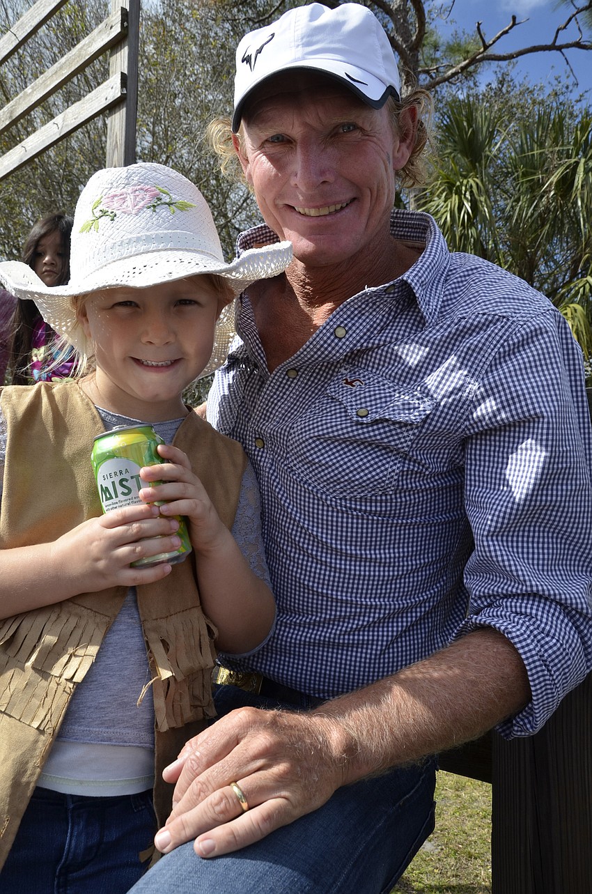 Jayda and Julien Link cheer on the polo players.