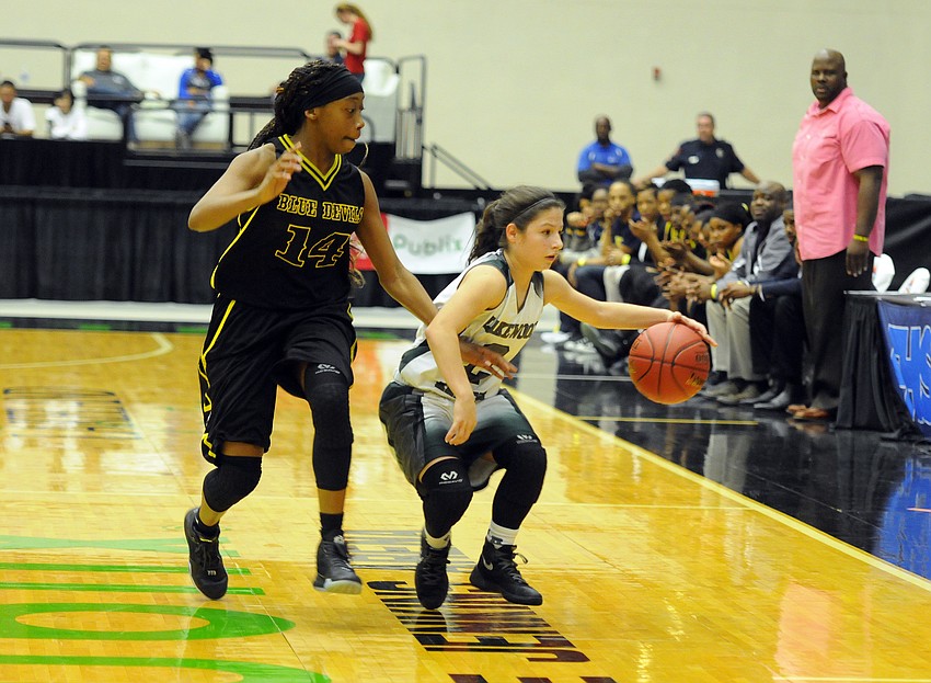 Lakewood Ranch sophomore guard Sarah Fazio dribbles around Winter Haven's Melody Brewington.
