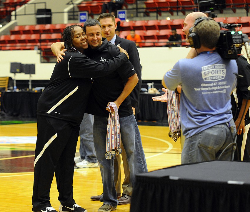 Lakewood Ranch principal Craig Little congratulates coach Tina Hadley on a great season.