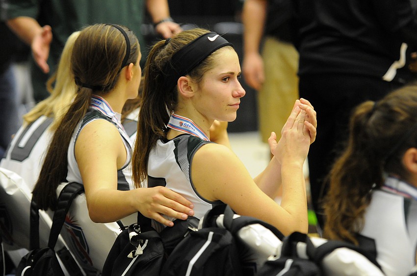 Lakewood Ranch senior guard Kailyn Scully looks on as Winter Haven receives its championship trophy.