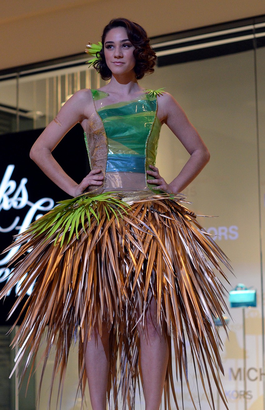 Raven Peters models Stephanie Peters's 'Last Summer' — made from plastic beach rafts, palm fronds and glitter