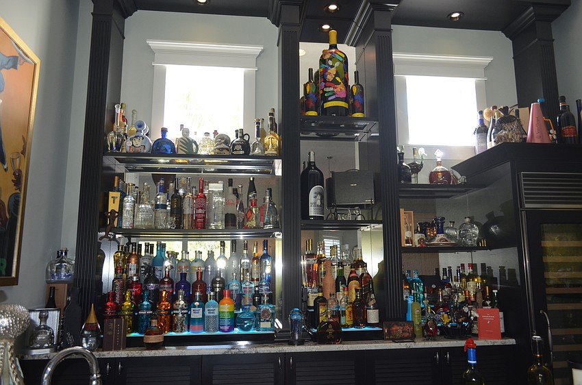 The custom bar displays liquor bottles Tim and Toni Bixler collected on their travels.