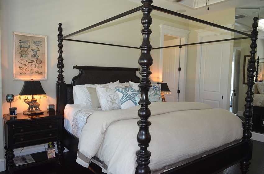 The master suite has a cozy tropical feel.