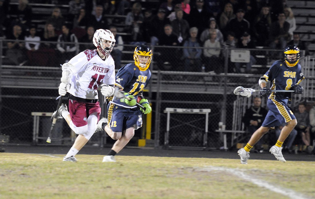 Riverview's Dusty Hibbs races across the field with the ball.