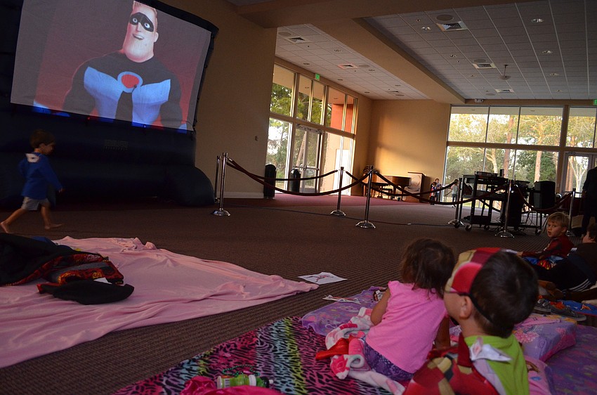 Adir Tivi, dressed as Ironman, focuses on the movie 