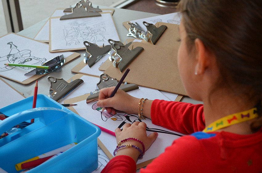 Ana Yavitz completes her coloring page.