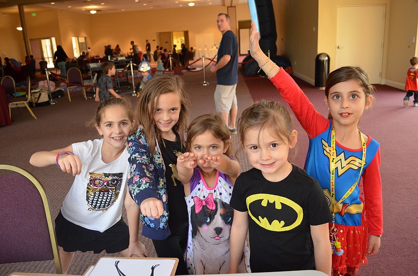 Liza Collier, Kirra McLoughlin, Liv Yatvitz, Reese McLoughlin and Ana Yavitz strike their superhero poses.