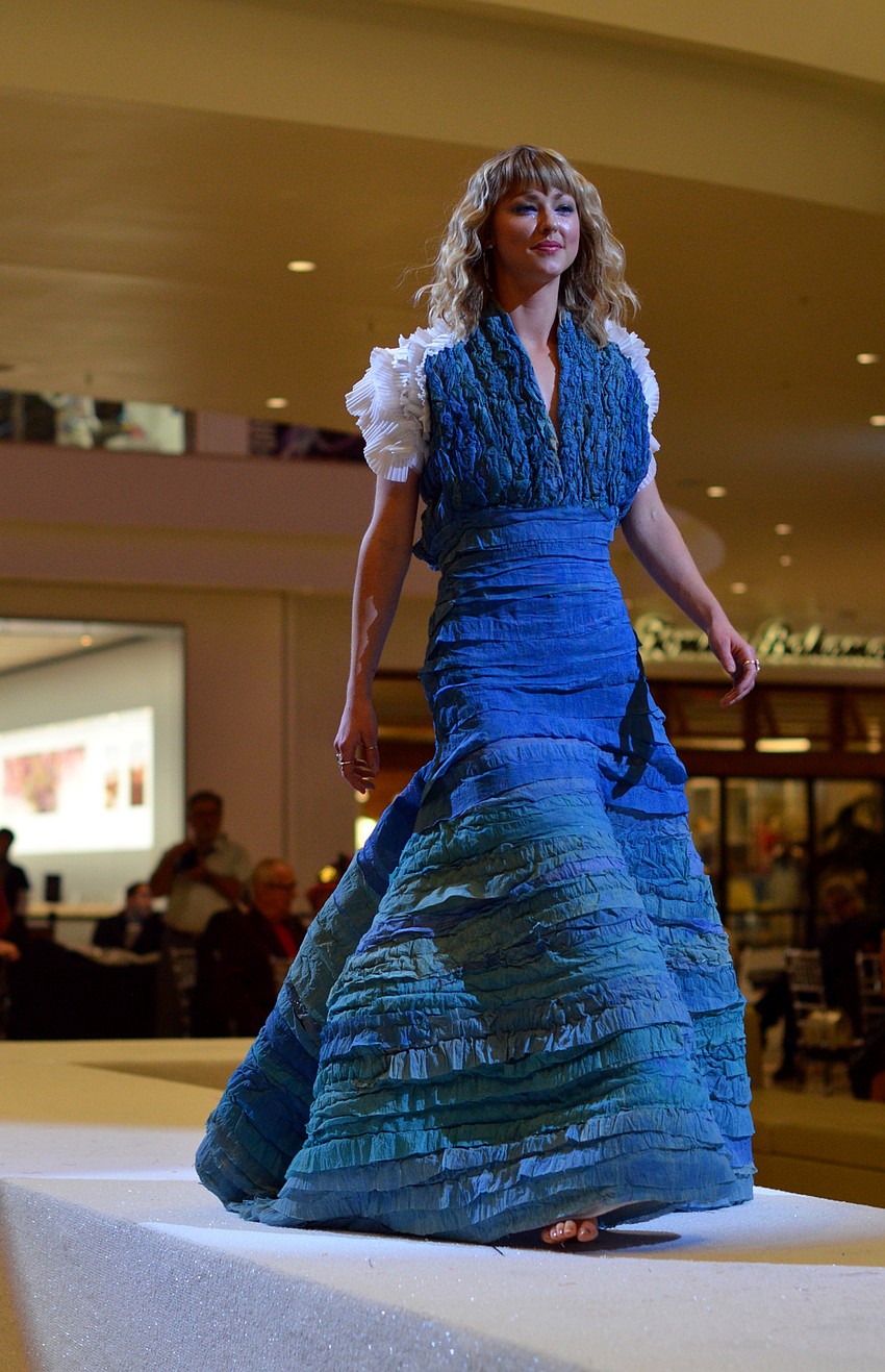 Ella Hillebrand models Eric Cross's 'She Sees The Sea' — made from polystyrene sheeting, paper sheeting for packing and crinkled polystyrene sheeting