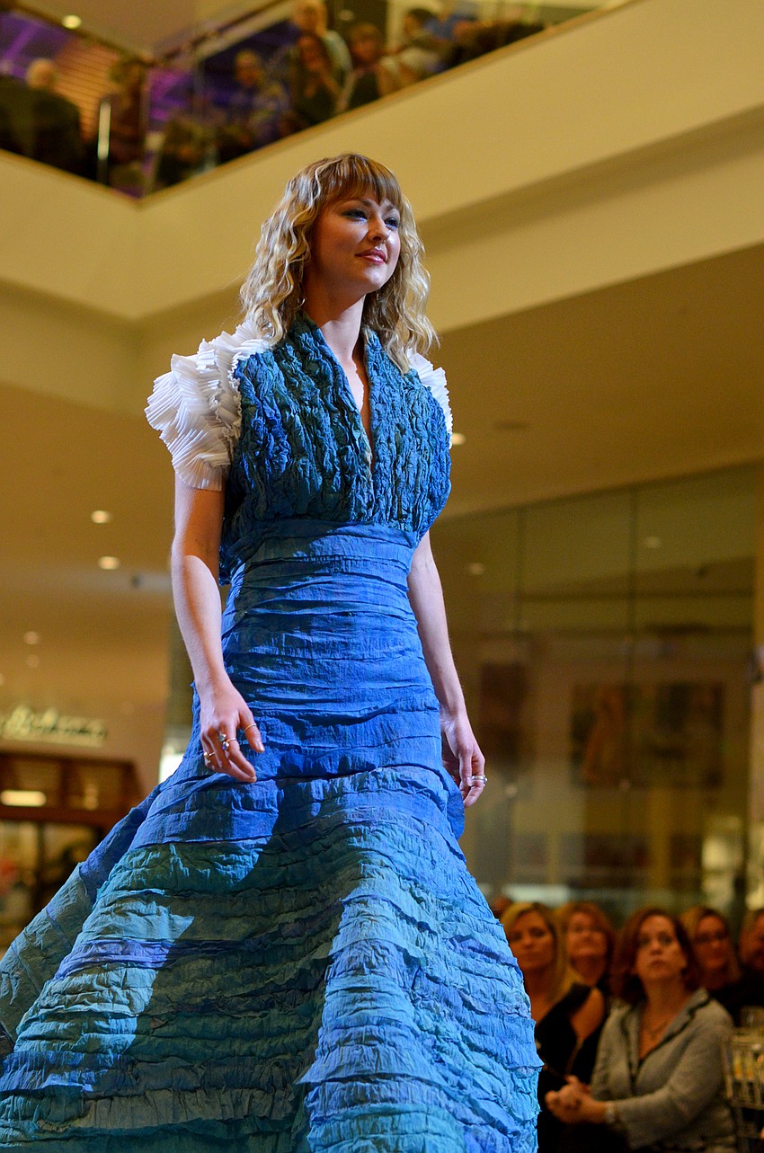 Ella Hillebrand models Eric Cross's 'She Sees The Sea' — made from polystyrene sheeting, paper sheeting for packing and crinkled polystyrene sheeting