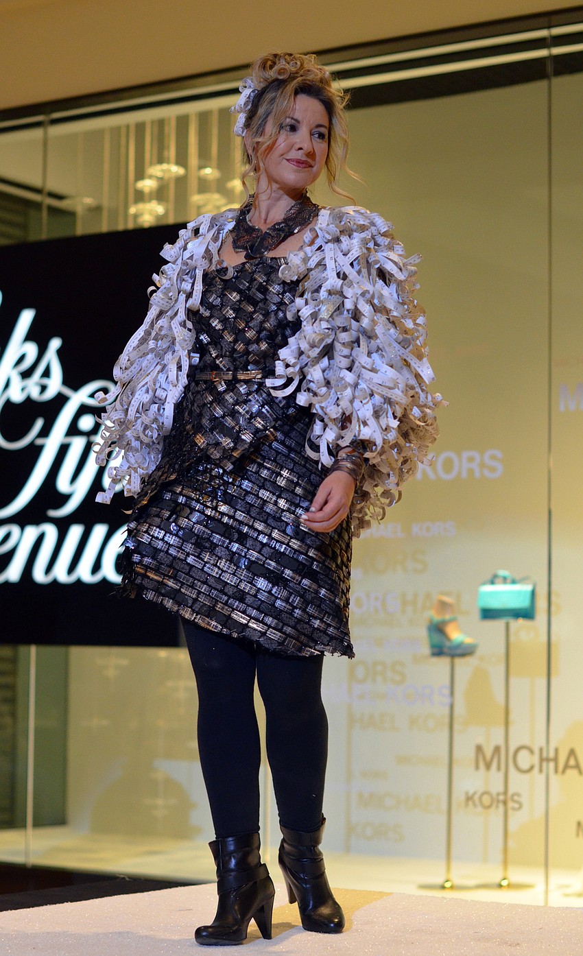 Jean Houndsome models Marcia Ente's 'Measuring Up' — made from paper yardsticks, mailbox numbers and hand-made paper