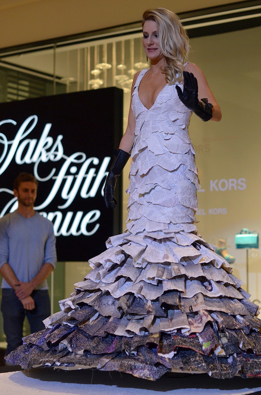 Sarah Fulton models Barbara Gerdeman's 'Femme Forte' made from Femme Rouge Magazines, lumber strapping and duct tape