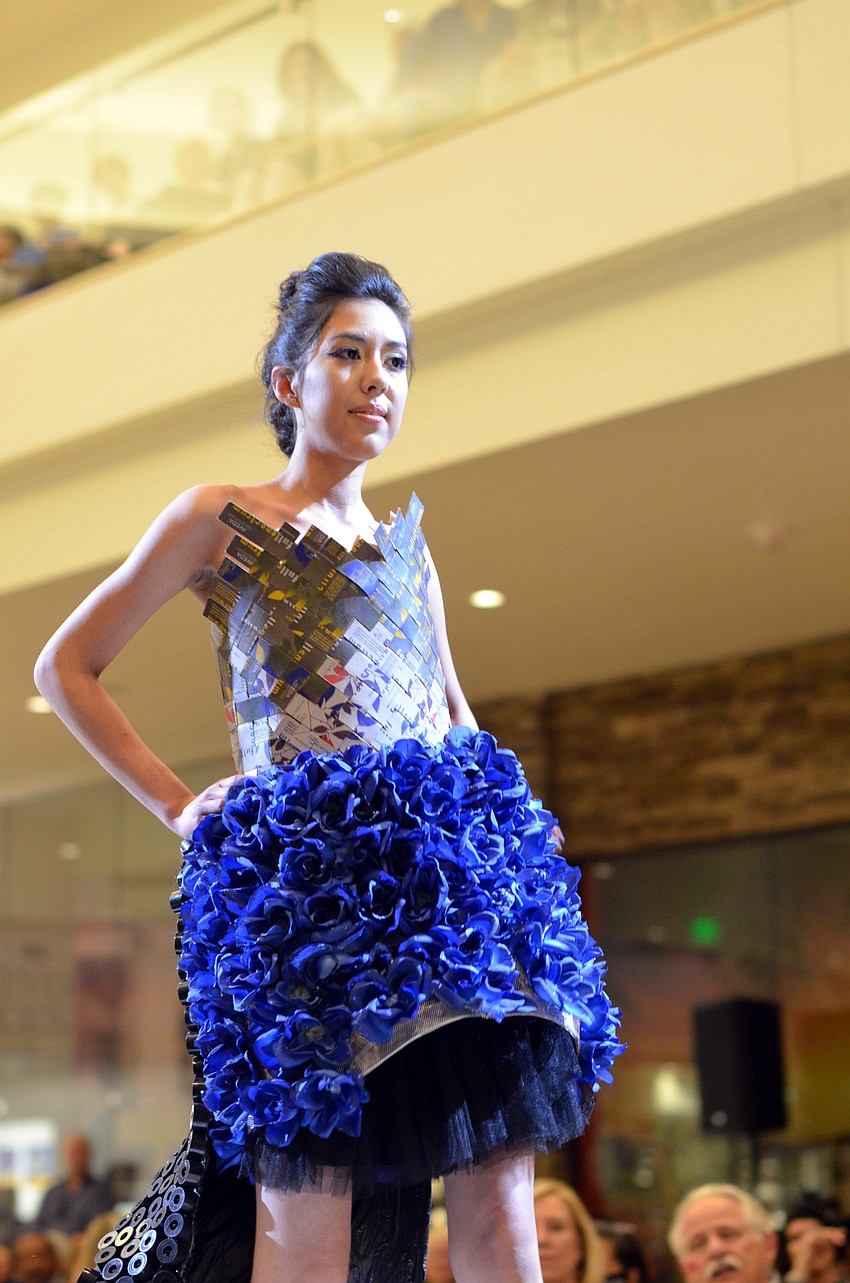 Jessica Cabrera models Samantha Kelly's 'Blooming Color' — made from Aveda hair color boxes, color tube caps and wire mesh