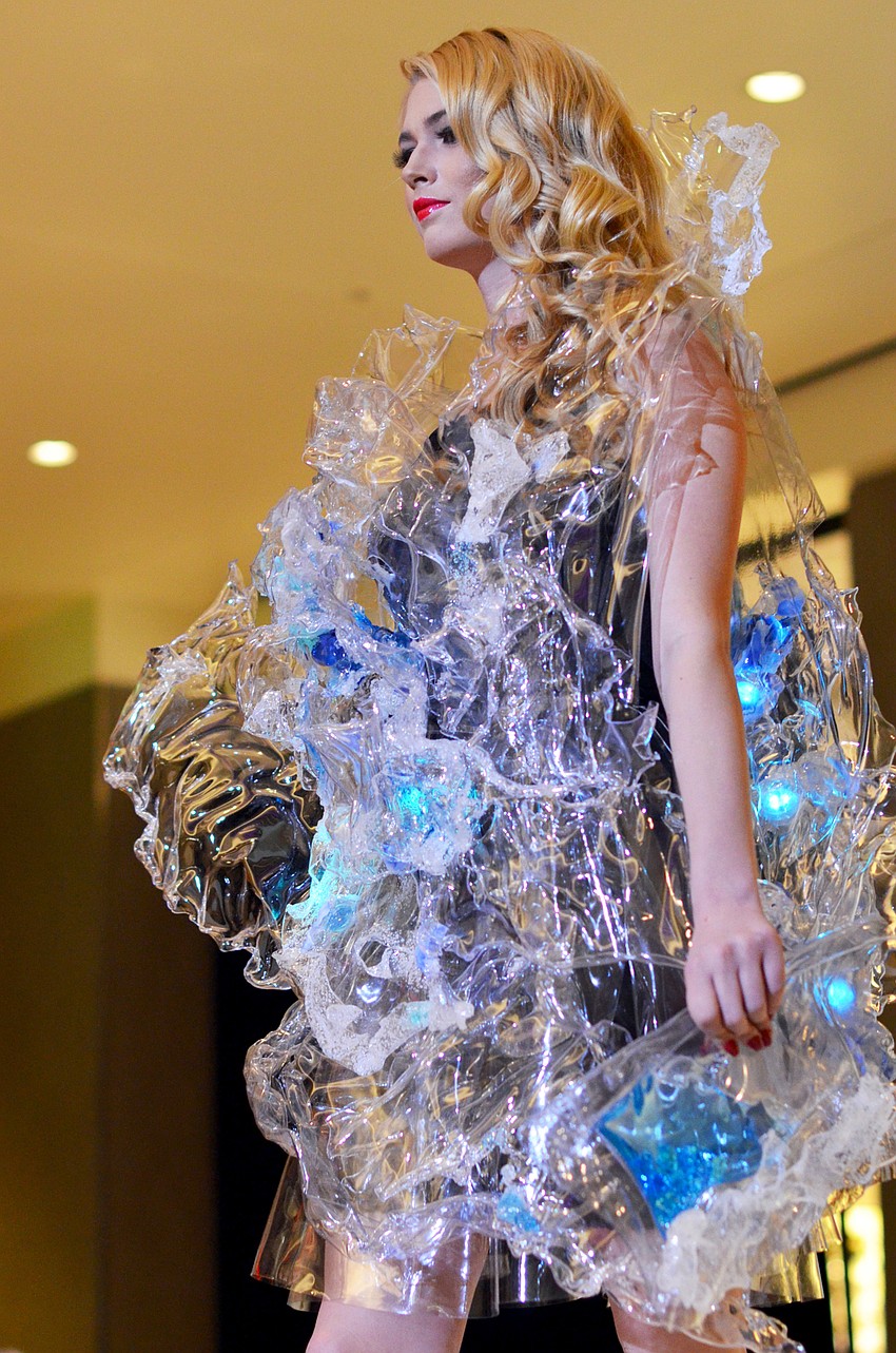 Kathleen Wisneski models Alexandra Lin's 'A Splash of Sarasota'  — made from recyclable plastic, packaging, water and Sarasota sand