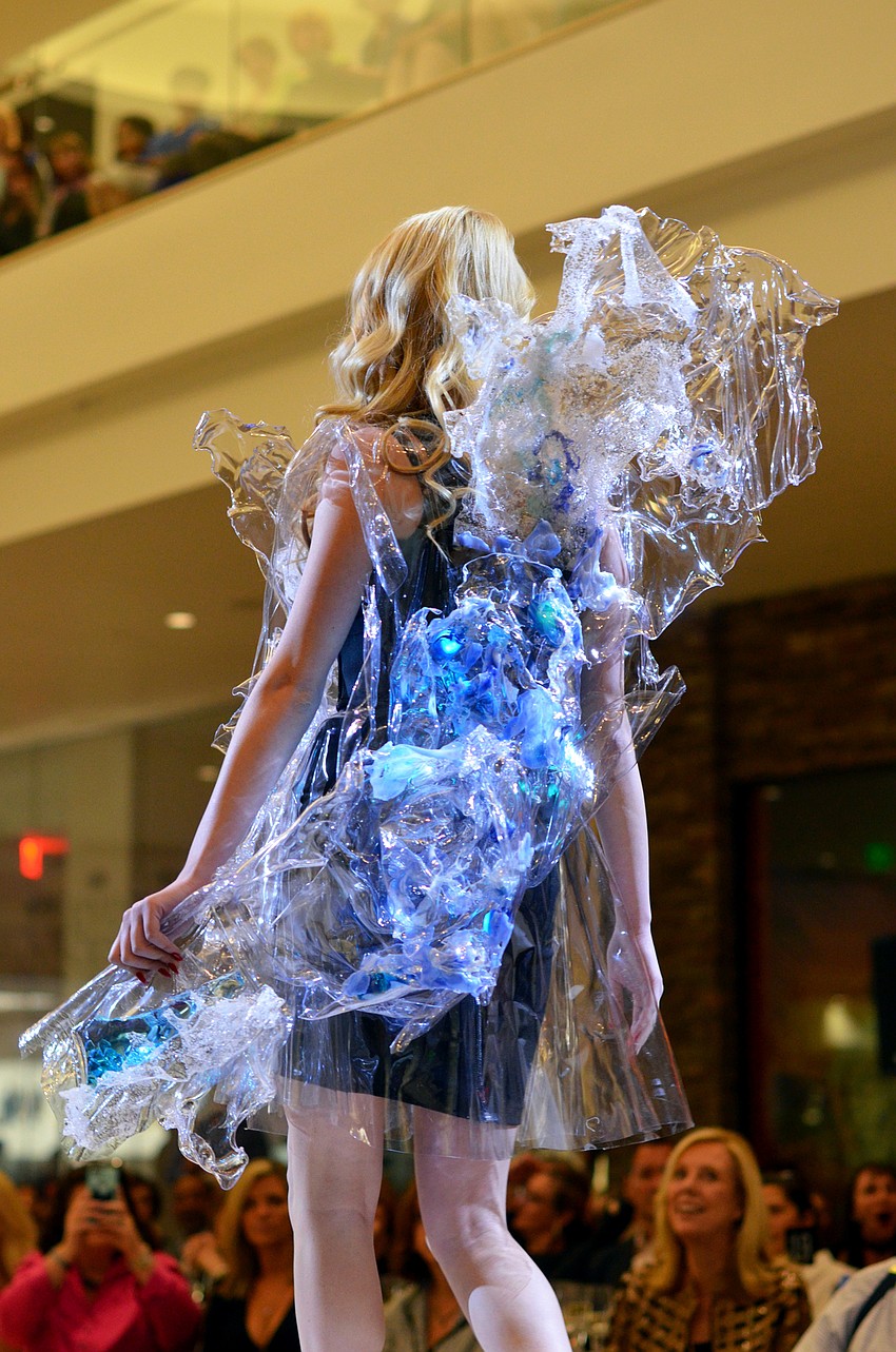 Kathleen Wisneski models Alexandra Lin's 'A Splash of Sarasota'  — made from recyclable plastic, packaging, water and Sarasota sand