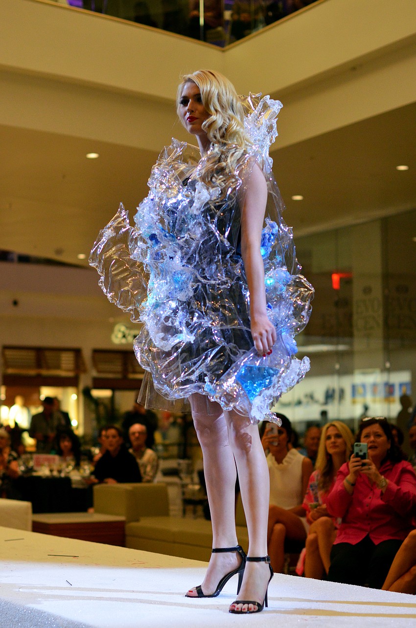 Kathleen Wisneski models Alexandra Lin's 'A Splash of Sarasota'  — made from recyclable plastic, packaging, water and Sarasota sand
