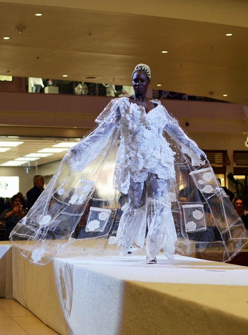 Gwen Thomas models Ray Pepper's 'Pockets Full of Posies' — made from lace curtains, lace tablecloth and bed in a bag packaging