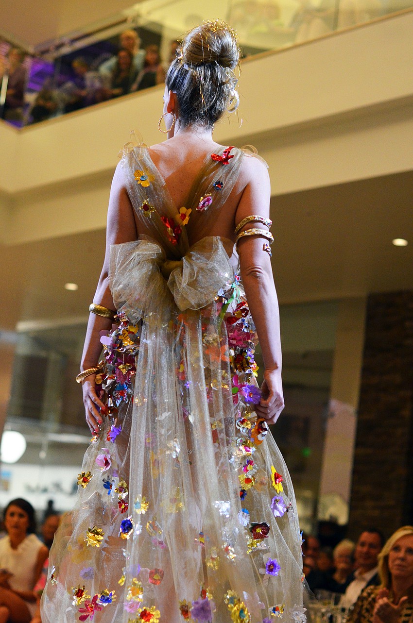 Liz Dobbins models Pamela Sumner's 'Dessert, Anyone?' — made from candy wrappers and snack food packaging