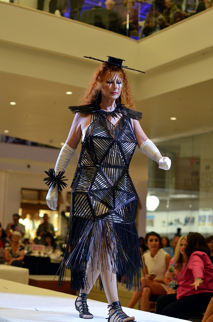 Colleen White models Colleen and David White's 'Dymaxion Dress' — made from 3,500 plastic drinking straws, Fireline Kevlar, fishing line and Matboard