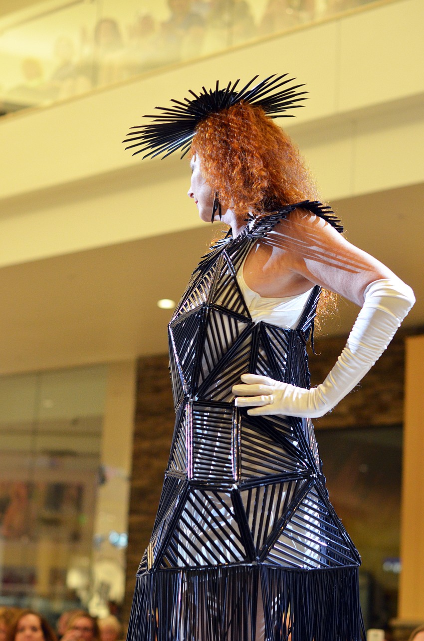 Colleen White models Colleen and David White's 'Dymaxion Dress' — made from 3,500 plastic drinking straws, Fireline Kevlar, fishing line and Matboard