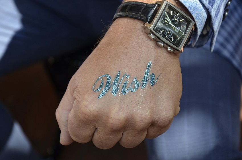 Scott Allen got a glitter tattoo by Libby St. Martin.